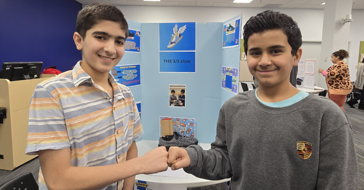 two boys fist bumping